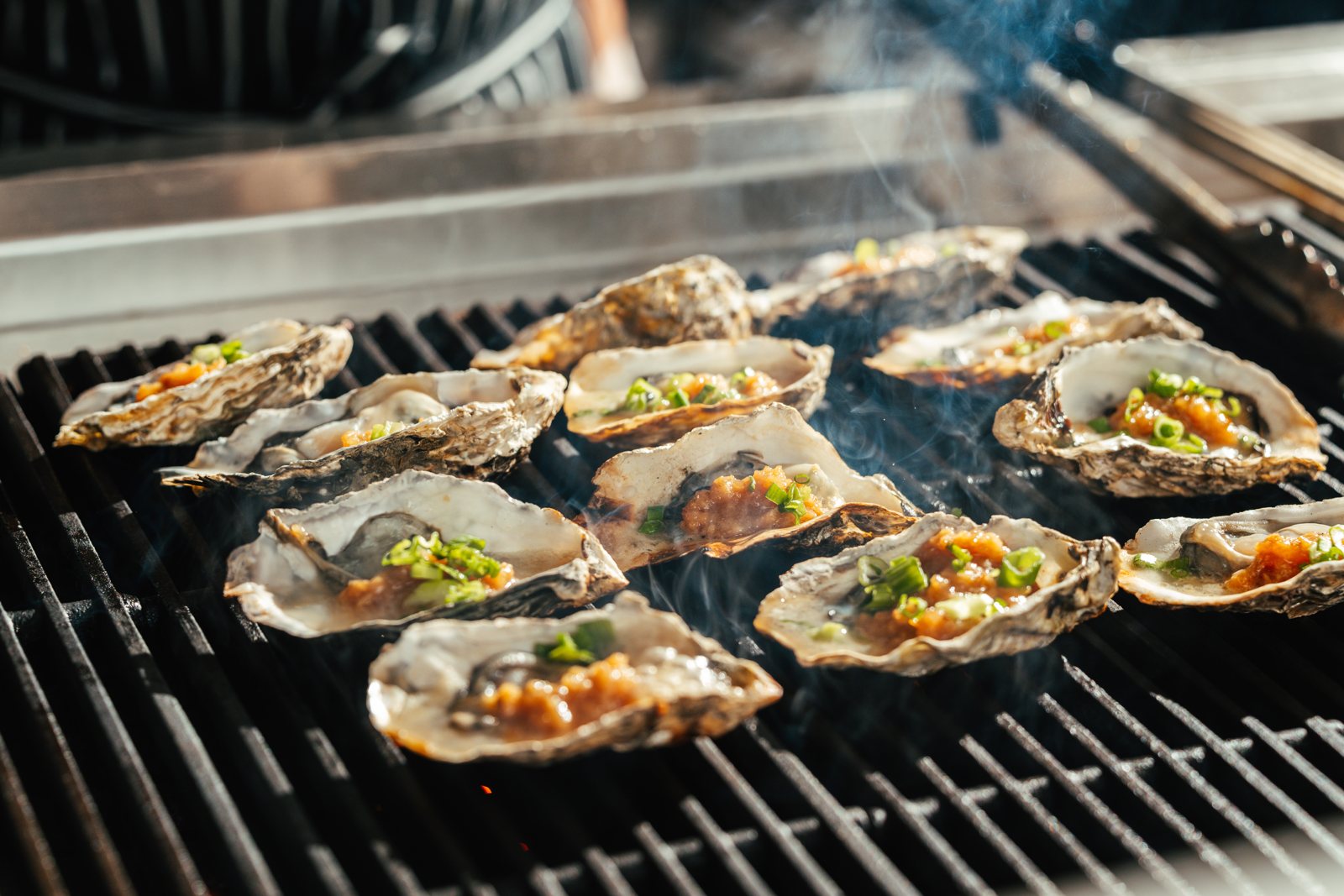 Chargrilled oysters with scallion and savory sauce at UMI Buffet